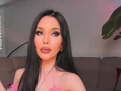 Big tit shemale jerks her long cock